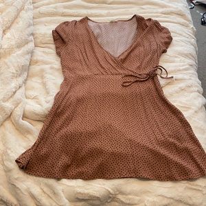 Short rust colored dress with small black flowers